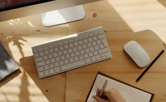 person writing on notebook